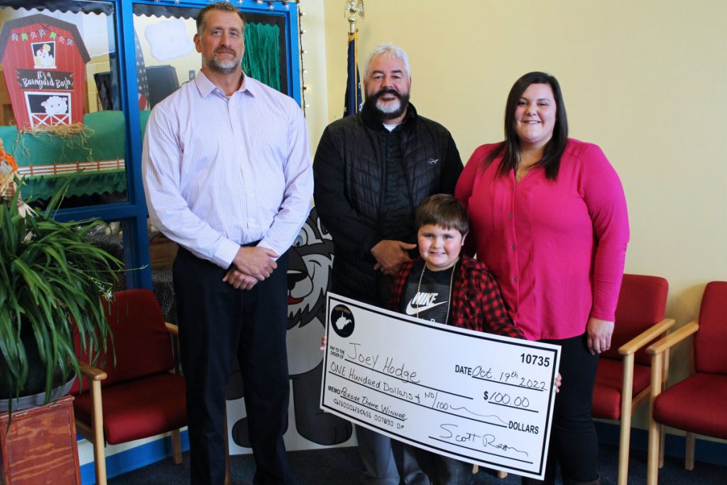 Joey is pictured holding the large $100 check he was presented for winning the Chamber’s parade theme contest. Also pictured from left: Chamber Board President Zack Blair, Chamber Executive Director Scott Reager and Janis Hodge, Joey’s mother.